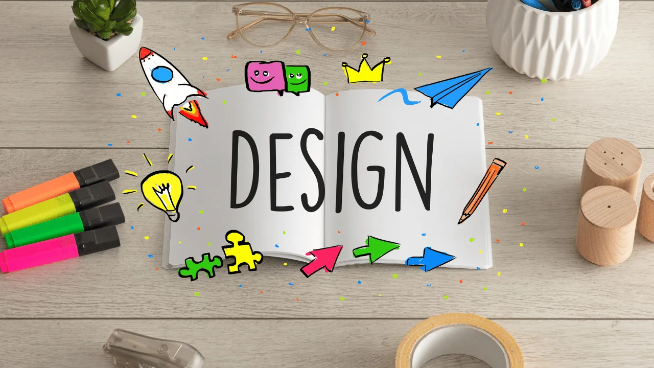 An open notebook on a wooden desk with the word 'DESIGN' surrounded by colorful doodle illustrations including a rocket, lightbulb, and paper airplane.