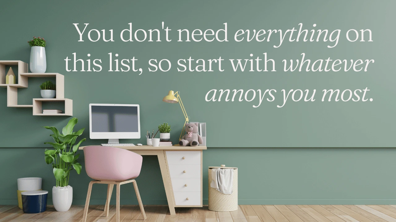 Minimalist desk setup with a computer and quote saying 'You don't need everything on this list, so start with whatever annoys you most'.